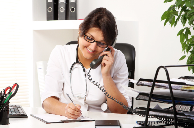 young-woman-doctor-talking-by-phone (1)